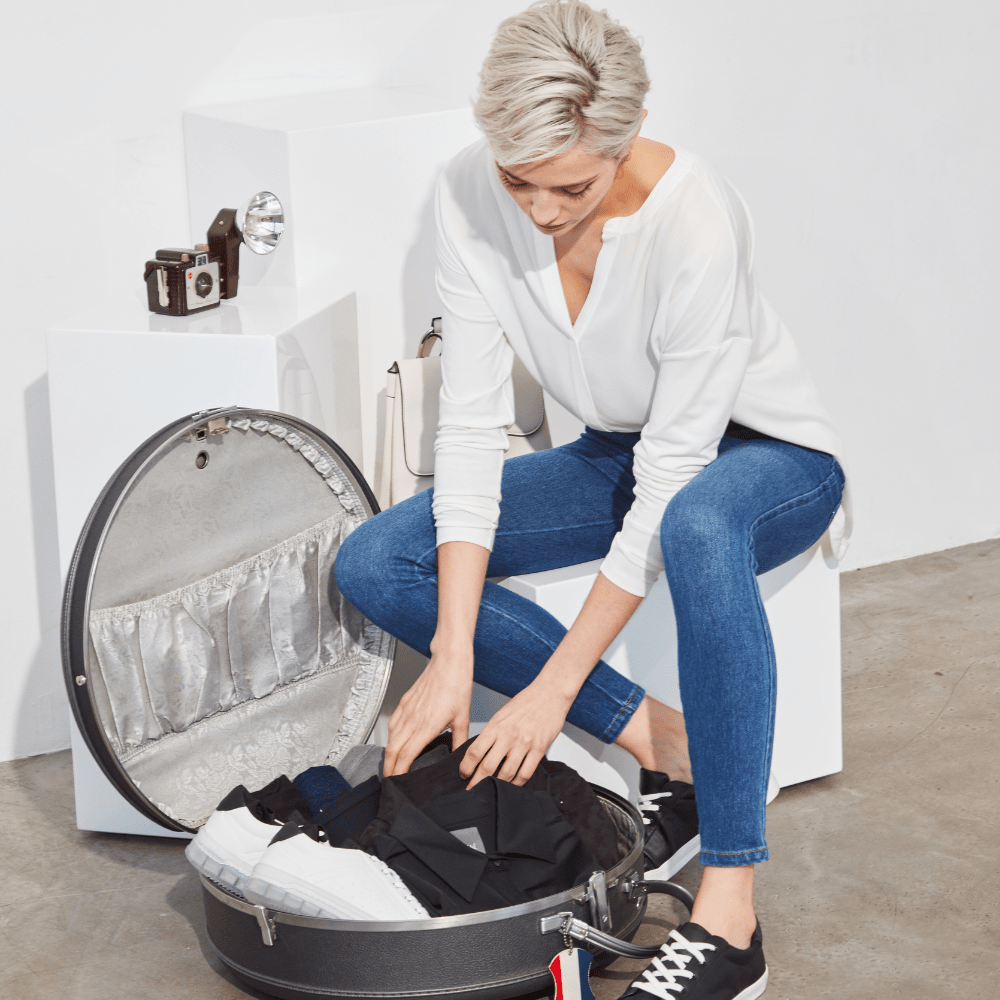 Woman packing a suitcase