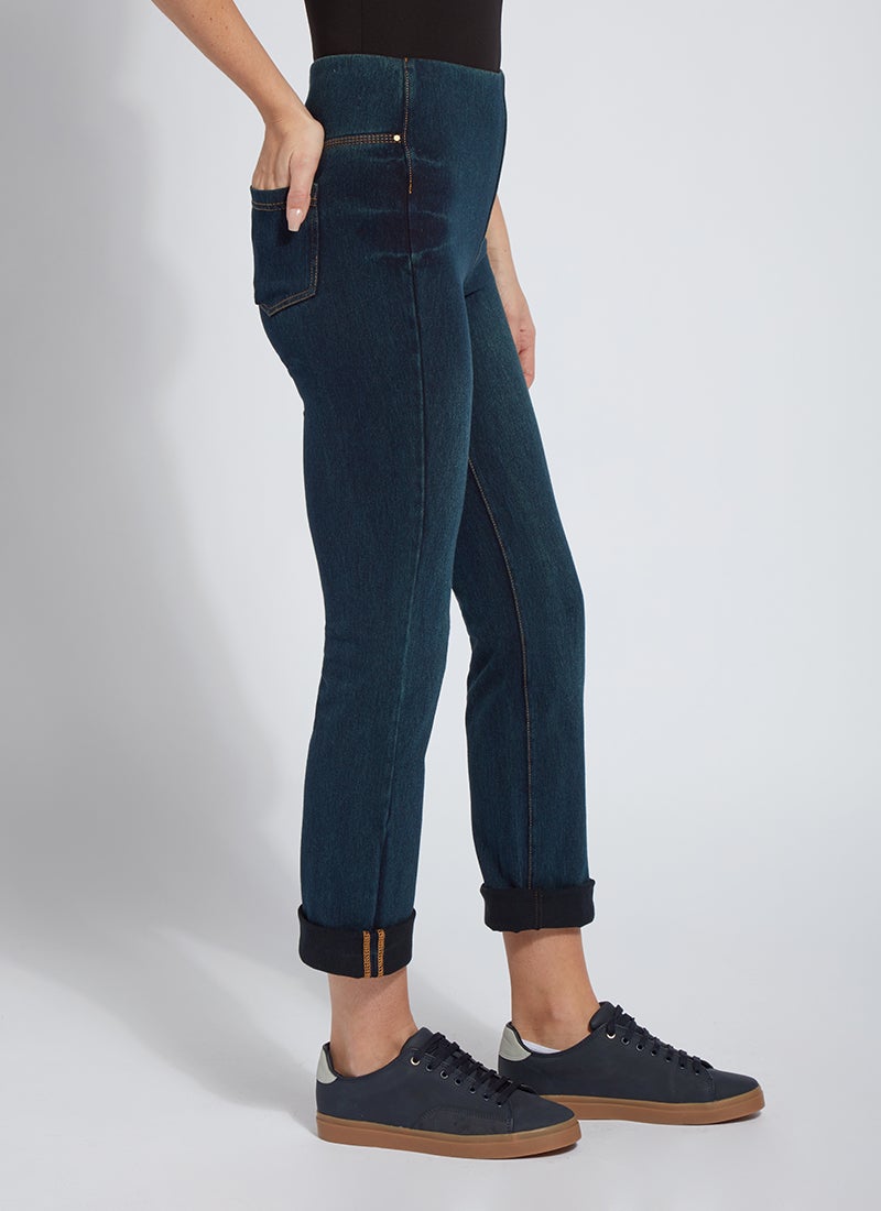 color=Indigo, side view, plus size boyfriend cut denim leggings with comfort waistband to smooth and slim 