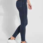 color=Indigo, Side view of indigo  toothpick denim jean leggings with patented concealed waistband, seen from waist down