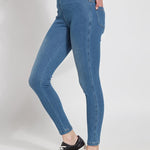 color=Mid Wash, Side view of mid wash blue,  toothpick denim jean leggings with patented concealed waistband, seen from waist down