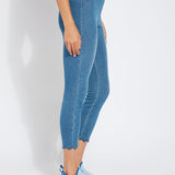 color=Mid Wash, side view, comfortable summer denim jegging with scalloped hemline. Cropped, slim legging with comfort waistband