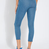 color=Mid Wash, back view, comfortable summer denim jegging with scalloped hemline. Cropped, slim legging with comfort waistband