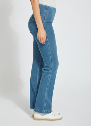 color=Mid Wash, side view, knit denim jean leggings with deep side pocket, skims hips and thighs and opens into bootcut hem