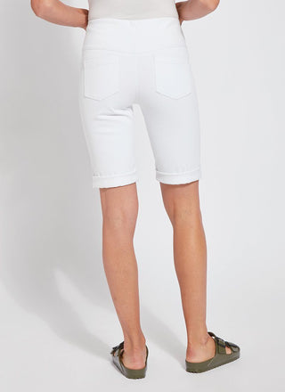 color=White, back view, women's denim jean short, smoothing comfort waistband, body hugging in hips and looser across thigh